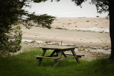 Picnic table by water